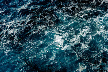 Fototapeta na wymiar Blue sea water surface, ocean waves pattern background