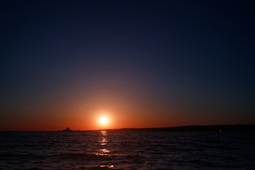 Fototapeta na wymiar Red sunset over the sea, river Volga