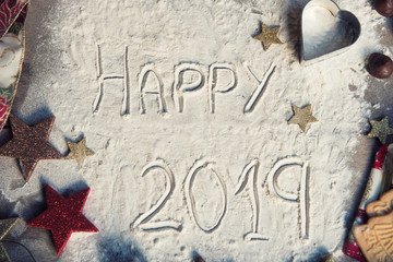 Happy 2019 text made with flour. Top view.