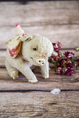 Pig with flowers on yellow background