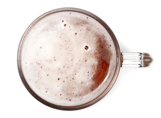 Mug of beer with bubble on glass isolated on white, top view