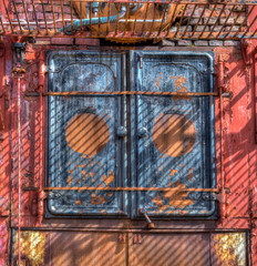 Doors of antique whaling boiler rusts from lack of use in Gryviken, South Georgia.tif