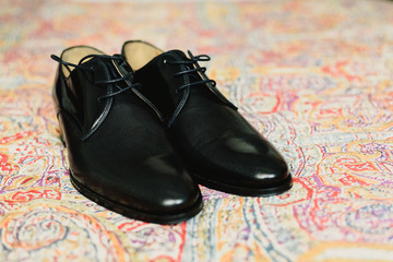 Fototapeta na wymiar Elegant dark colored men shoes