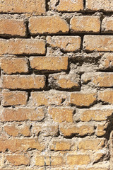 The old wall is made of brown brick. Vertical background for text, postcards and posters.