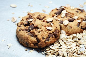 Chocolate cookies on rustic table. Chocolate chip cookies and cookies with oat flakes or oatmeal.