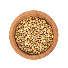 Top view of  dried coriander seeds in the wooden plate white background