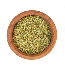 Dried Oregano in wooden bowl on white background Top view