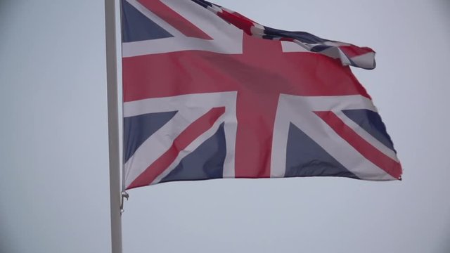 British Flag in Slow Motion (camera tilts up)