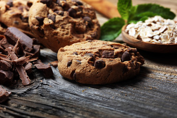 Chocolate cookies on rustic table. Chocolate chip cookies and cookies with oat flakes or oatmeal.