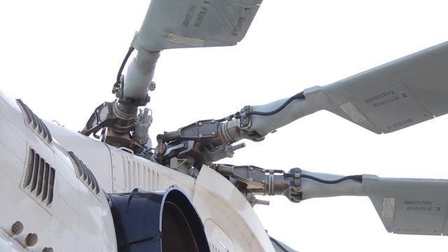 Checking the helicopter's propeller and blades before flying