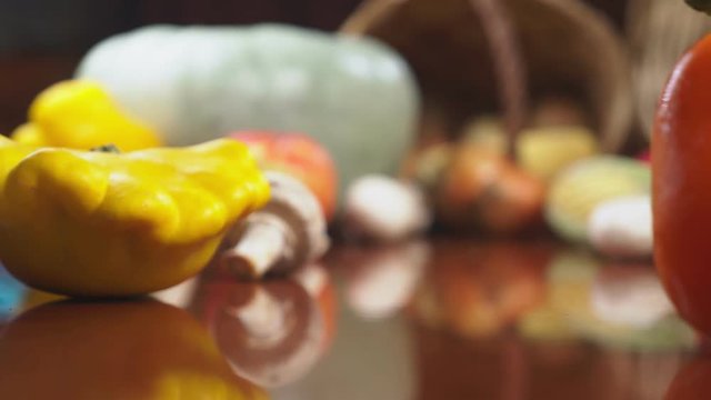 Autumnal Harvest or Thanksgiving, Cornucopia filled with vegetables, vegetables spilled out of the basket on the table. 4k, dolly shot