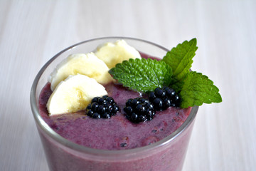 Banana and blackberry smoothie on the table