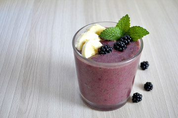 Banana and blackberry smoothie on the table