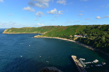 Fototapeta premium Bon Nuit harbour, Jersey, U.K. Summer evening at high tide.