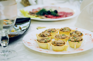 tartlets with meat pate. food on the table.