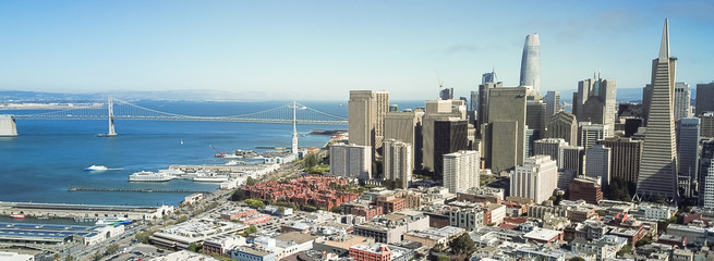 Panorama aerial view Jackson Square neighborhood with downtown skylines and Bay Bridge in background