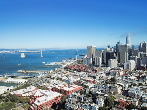 Aerial view San Francisco waterfront with Jackson Square neighborhood, Embarcadero boulevard, Bay Bridge and part of Financial District buildings
