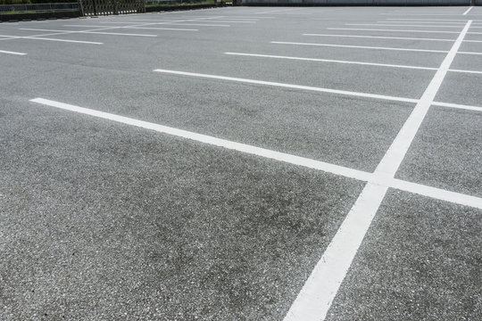 Car Parking lot with parking barrier, Vacant Parking Lot, Parking lane painting on floor, copy space