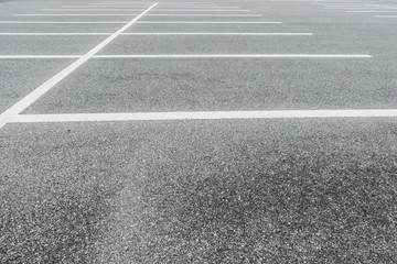 Fototapeta premium Asphalt Floor with parking lot at city center, Vacant Parking Lot, Parking lane painting on floor, copy space