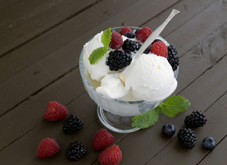 Ice cream balls in a glass vase.
