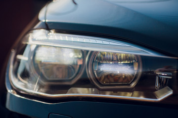 Obraz na płótnie Canvas Detail beauty and fast car with headlight