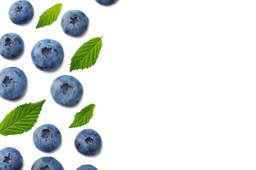 healthy background. blueberries with leaves isolated on white background. top view