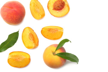 peach fruit with green leaf and slices isolated on white background. top view