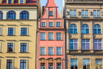 soft focus architecture concept of old city street small colorful houses facade in bright summer day time