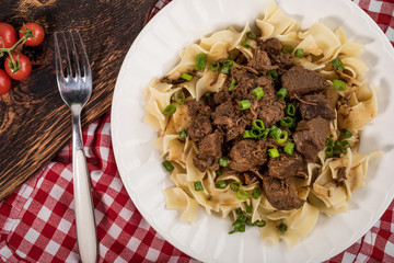 Stewed beef with tagliatelle pasta.