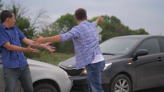 Two men arguing conflict after a car accident on the road car insurance. slow motion video. Two Drivers man Arguing After Traffic Accident. auto insurance lifestyle accident concept men. Two men