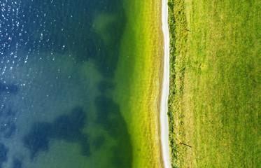Beautiful aerial landscape with water and the road along the beach