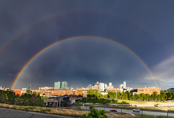 Double rainbow above the downtown skyline after a storm in Denver, Colorado