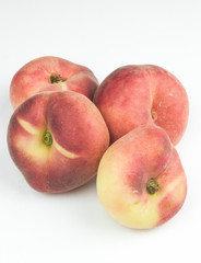 A group of whole nectarine fruits isolated on a white background. useful fruit. seasonal fruits.