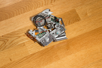 Disassembled broken compact digital camera parts