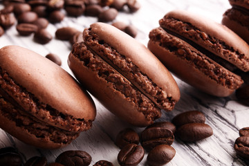 Sweet and colourful french macaroons or macaron with coffee