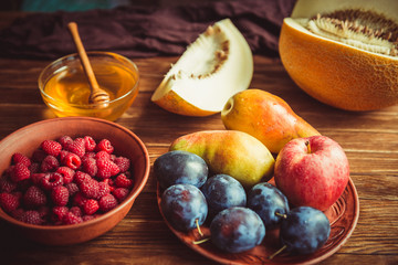 The new crop of fruit and honey on the table.