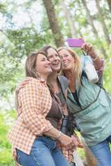 Middle Age and Senior Women Taking a Selfie Photo with Cell Phone