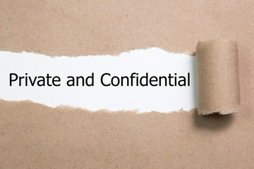 The word Private and confidential appearing behind torn paper.