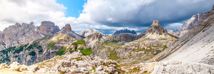 Tre Cime Hut, aka Dreizinnenhutte or Rifugion Antonio Locatelli with Torre di Toblin, aka Toblinge Knoten, on the background, Dolomites, Italy.