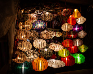 Asian lanterns illuminted in shop doorway