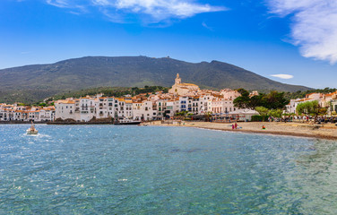 Fototapeta na wymiar Sea landscape with Cadaques, Catalonia, Spain near of Barcelona. Scenic old town with nice beach and clear blue water in bay. Famous tourist destination in Costa Brava with Salvador Dali landmark