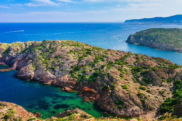 Sea landscape with Cap de Creus, natural park. Eastern point of Spain, Girona province, Catalonia. Famous tourist destination in Costa Brava. Sunny summer day with blue sky and clouds © oleg_p_100