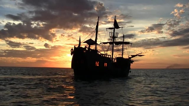 Pirate ship at sunset in the Caribbean