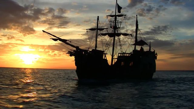 Pirate ship at sunset in the Caribbean