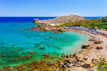Sea skyview landscape photo Ladiko bay near Anthony Quinn bay on Rhodes island, Dodecanese, Greece. Panorama with nice sand beach and clear blue water. Famous tourist destination in South Europe