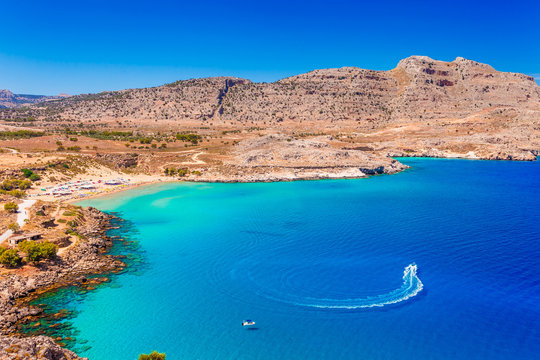 Sea skyview landscape photo of Agia Agathi beach near Feraklos castle on Rhodes island, Dodecanese, Greece. Panorama with sand beach and clear blue water. Famous tourist destination in South Europe