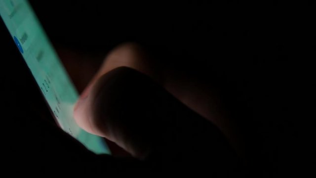 Person Texting on Smart Phone at Night