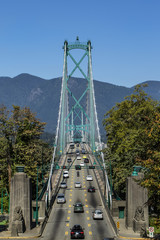 lions gate bridge front view from stanley park on a sunny summer day