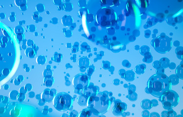 Radiant soap bubbles on blurred blue background. Rainbow soap bubble.