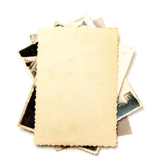 Stack old photos isolated on white background. Mock-up blank paper. Postcard rumpled and dirty...